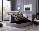 A contemporary, minimalistic grey linen ottoman bed frame. It has a sprung slatted base and a gas lift system.