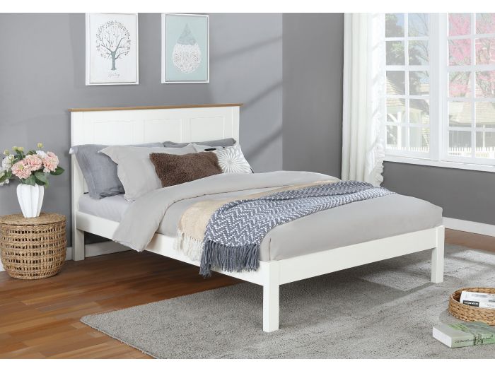 Classic style white painted wooden bed frame with a solid light oak headboard plinth. Low foot end. Panelled headboard.