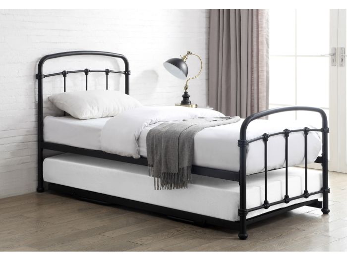 Black metal Victorian style guest bed with pull-out under bed. Curved headboard and footboard.