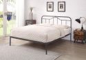 Black and silver metal bed frame with a curved headboard and low foot end. Elegant, minimal design