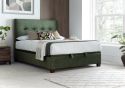 Luxurious moss green velvet ottoman bed frame with modern dark wooden feet.